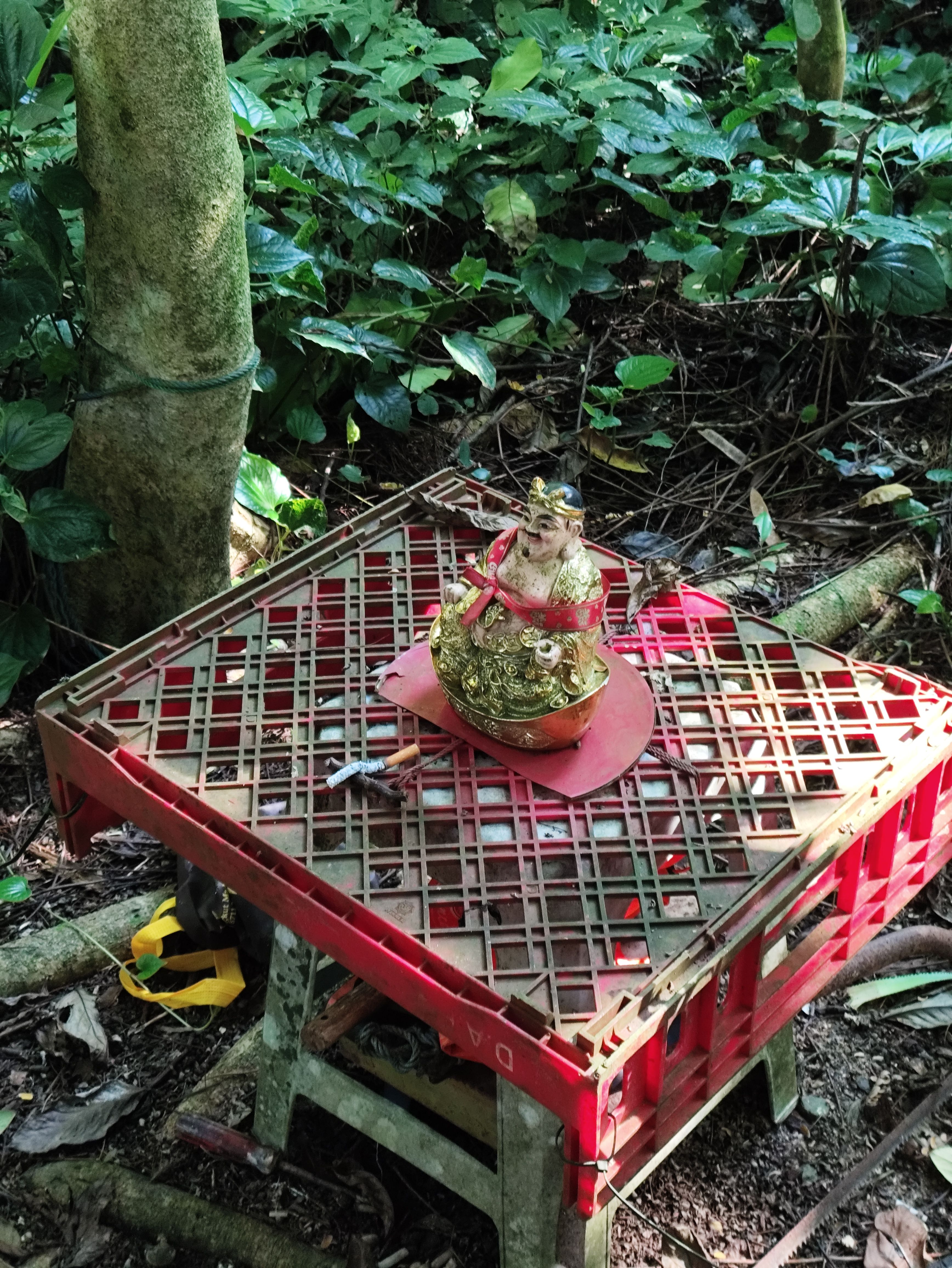 Shrine with cigarette on it