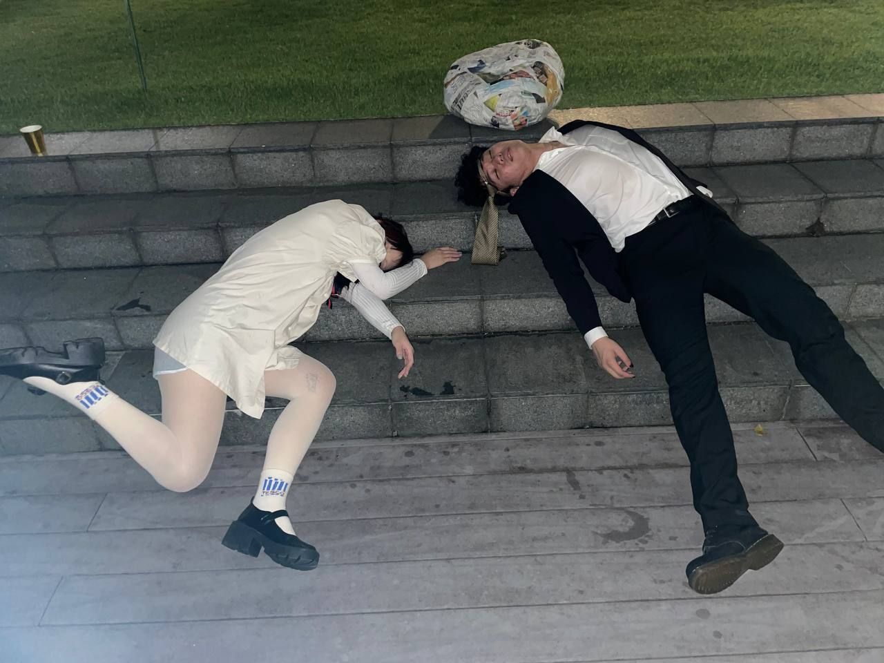 Me and a friend lying, knocked-out on the stairs
