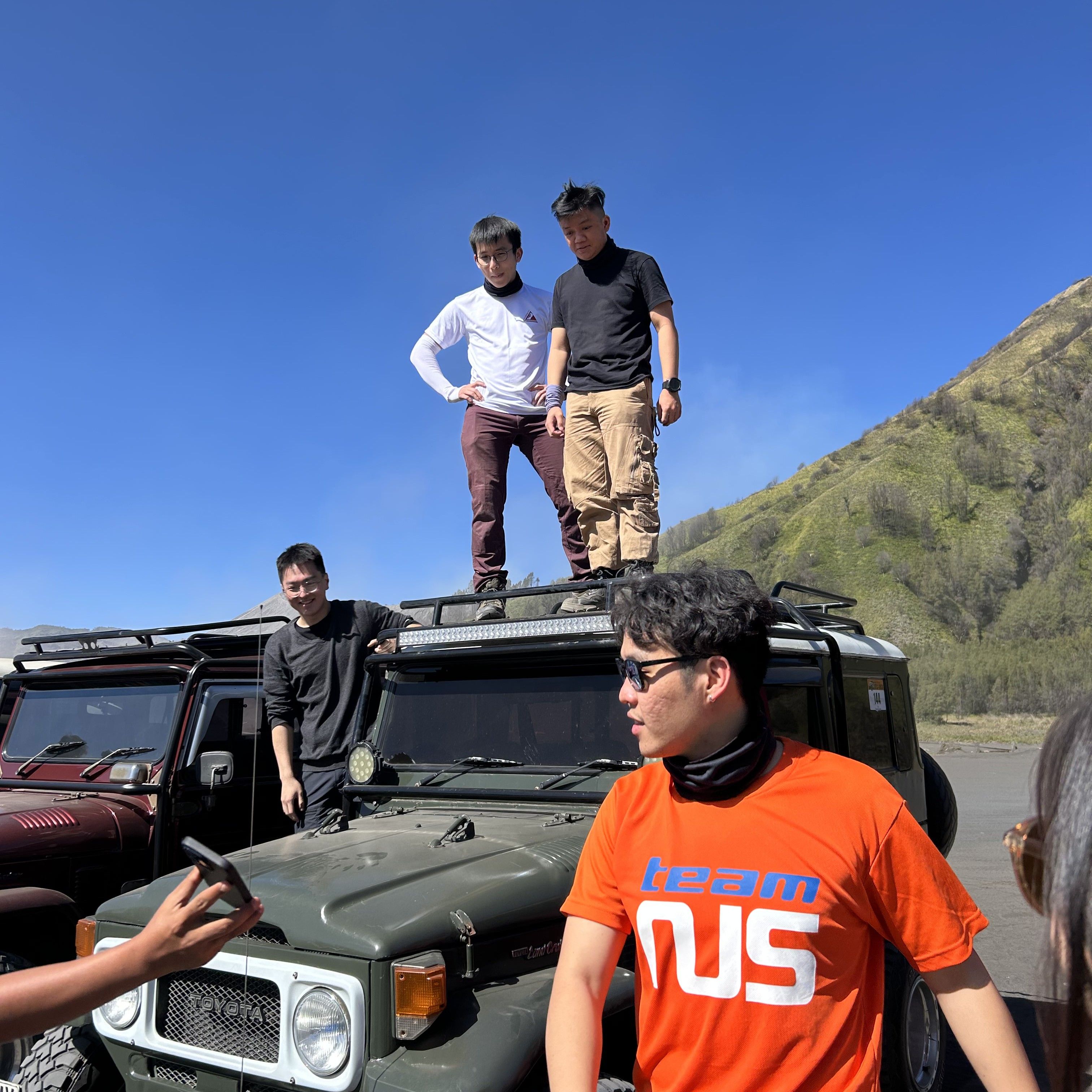 Us gathered around a jeep