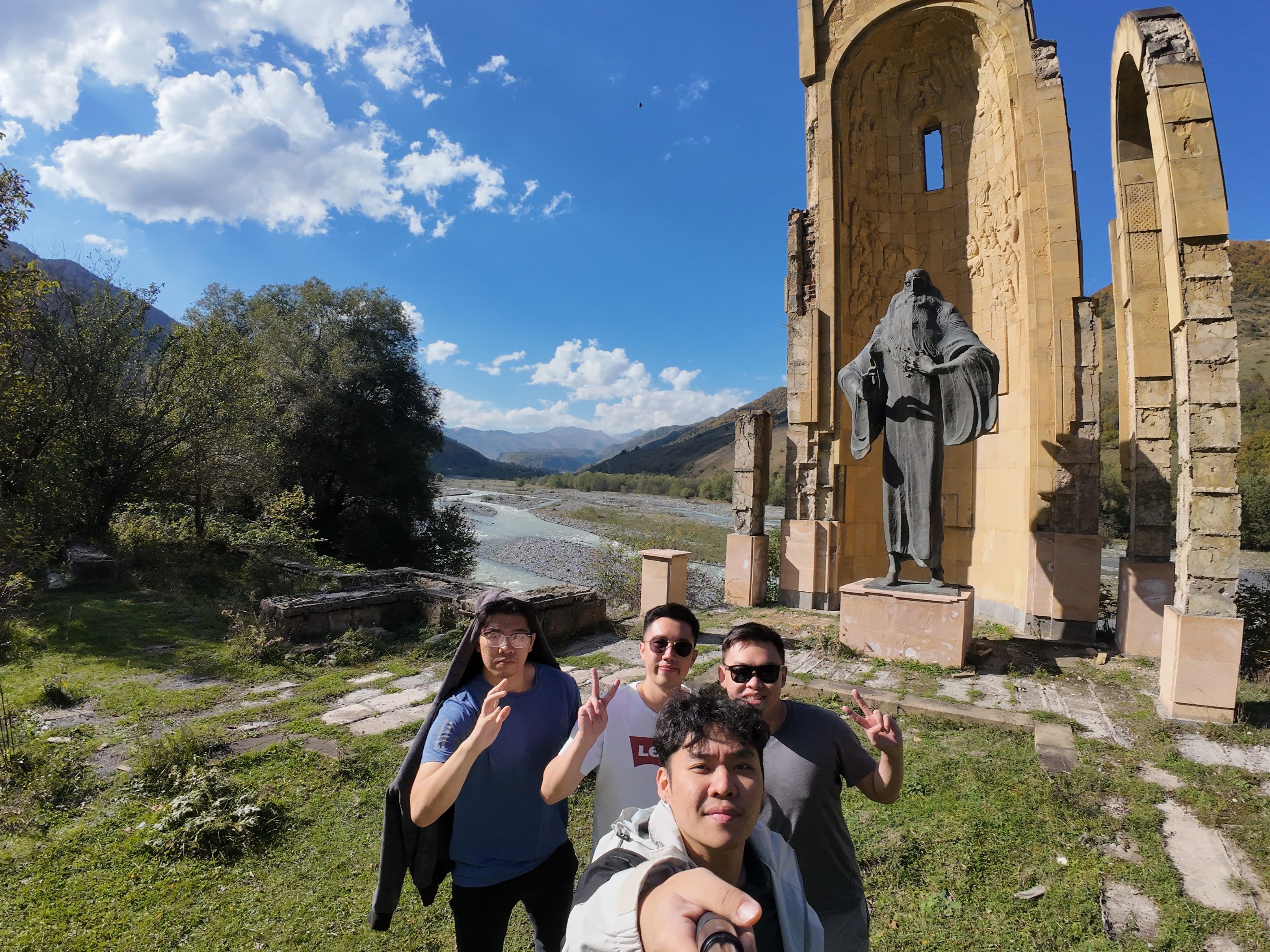 Group photo in front of a statue