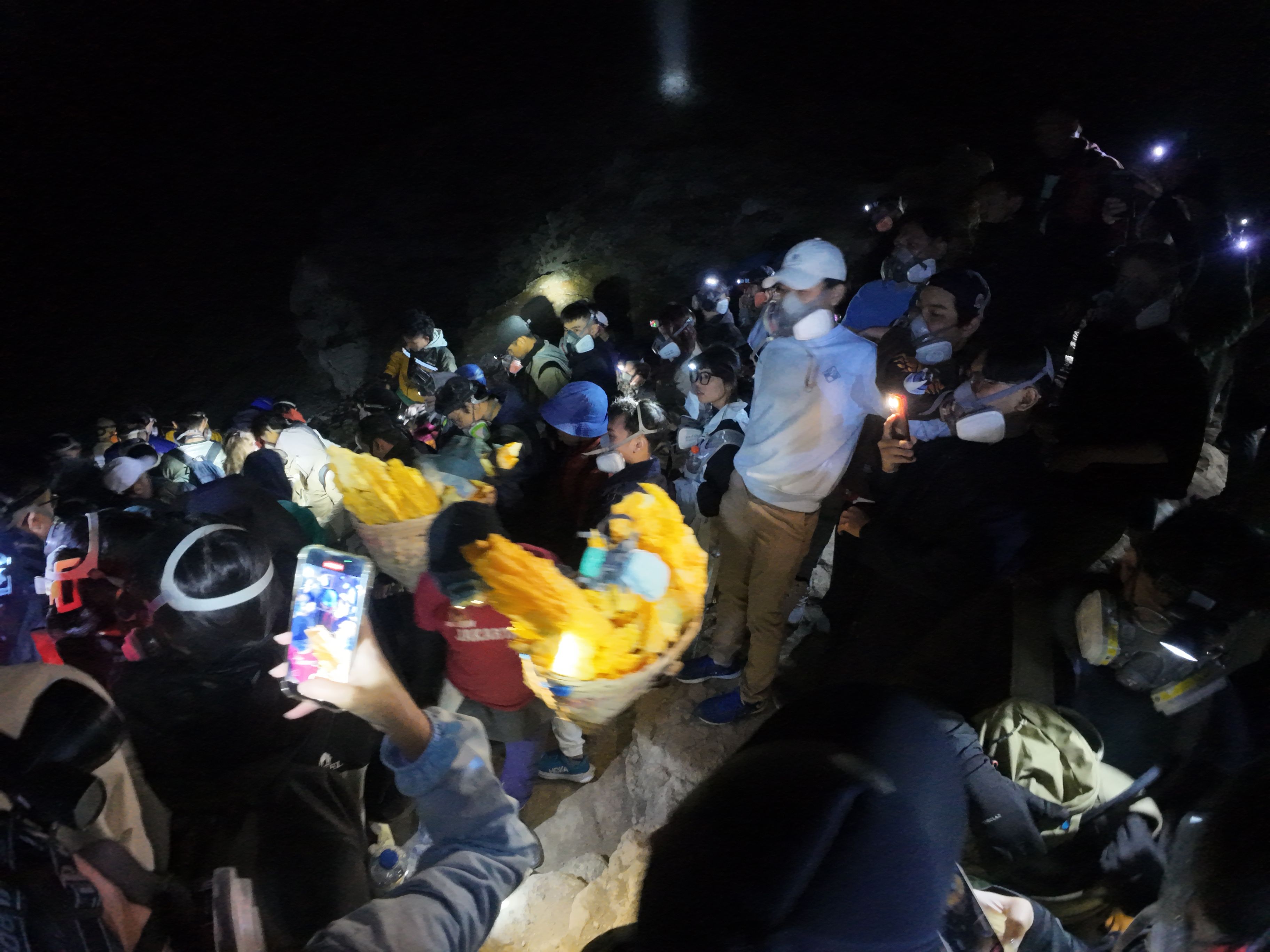 Crowd at Ijen with a miner in the middle