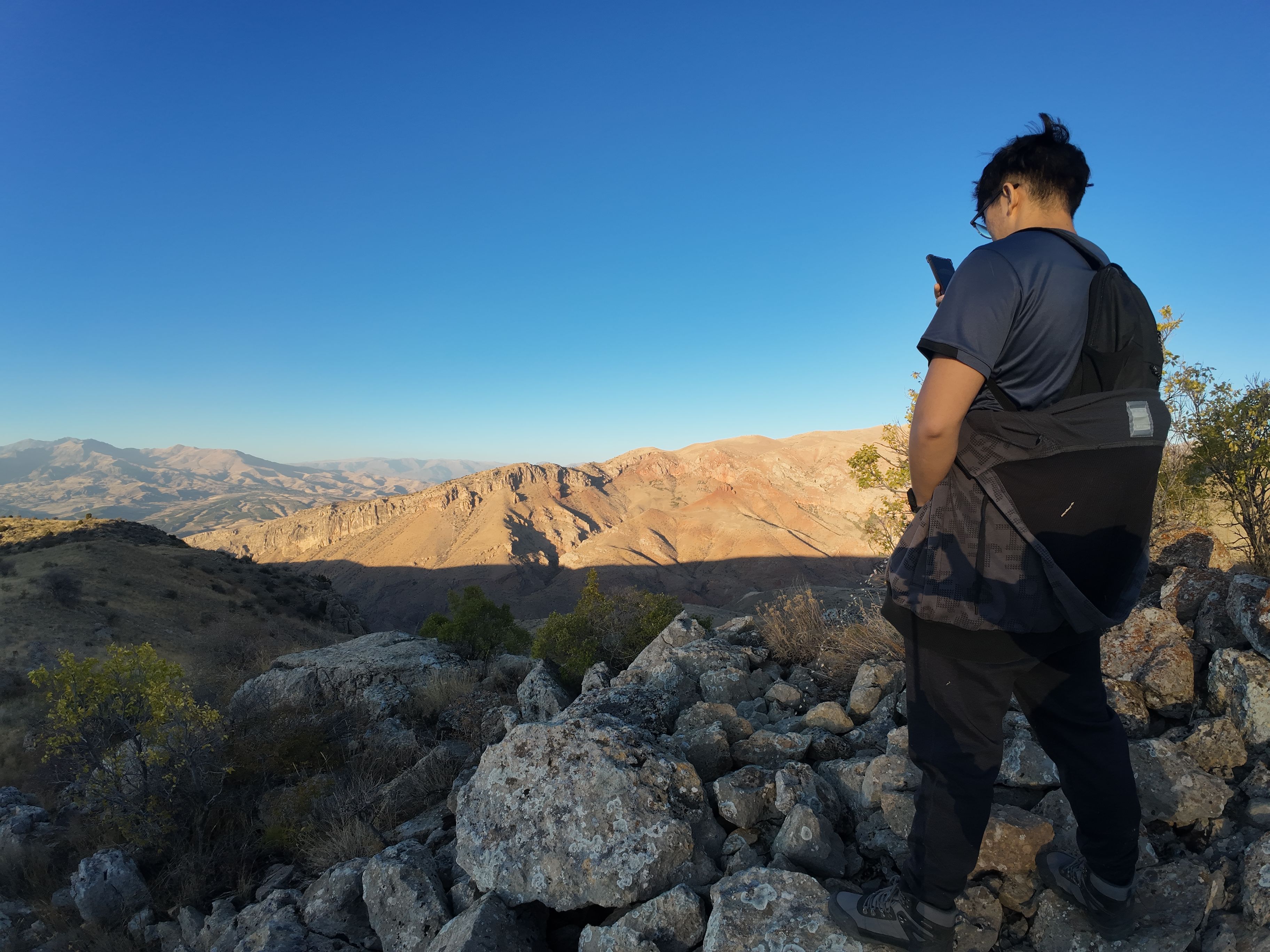 Friend pissing into the grass